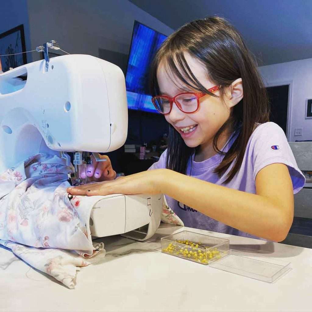 A little girl sews incredible clothes