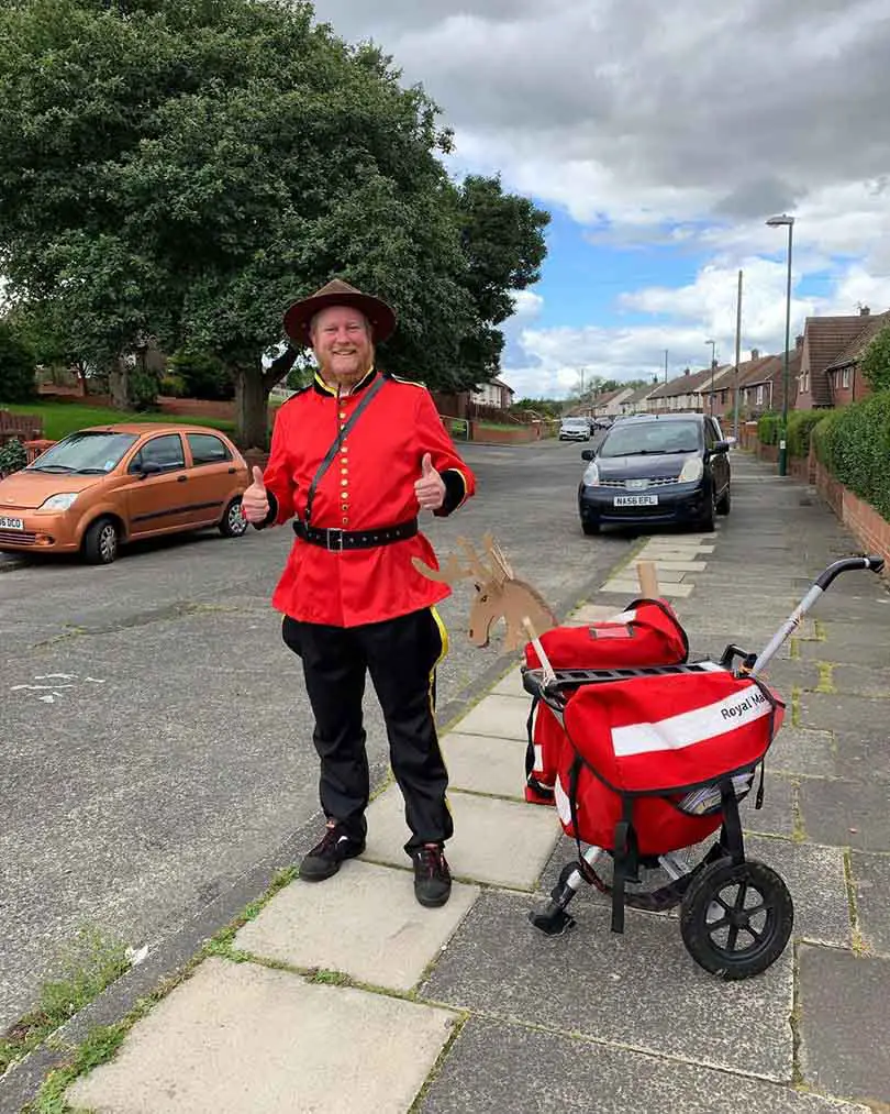 A Postman Makes His Deliveries In Funny Costumes