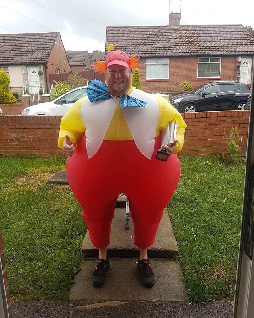 A Postman Makes His Deliveries In Funny Costumes